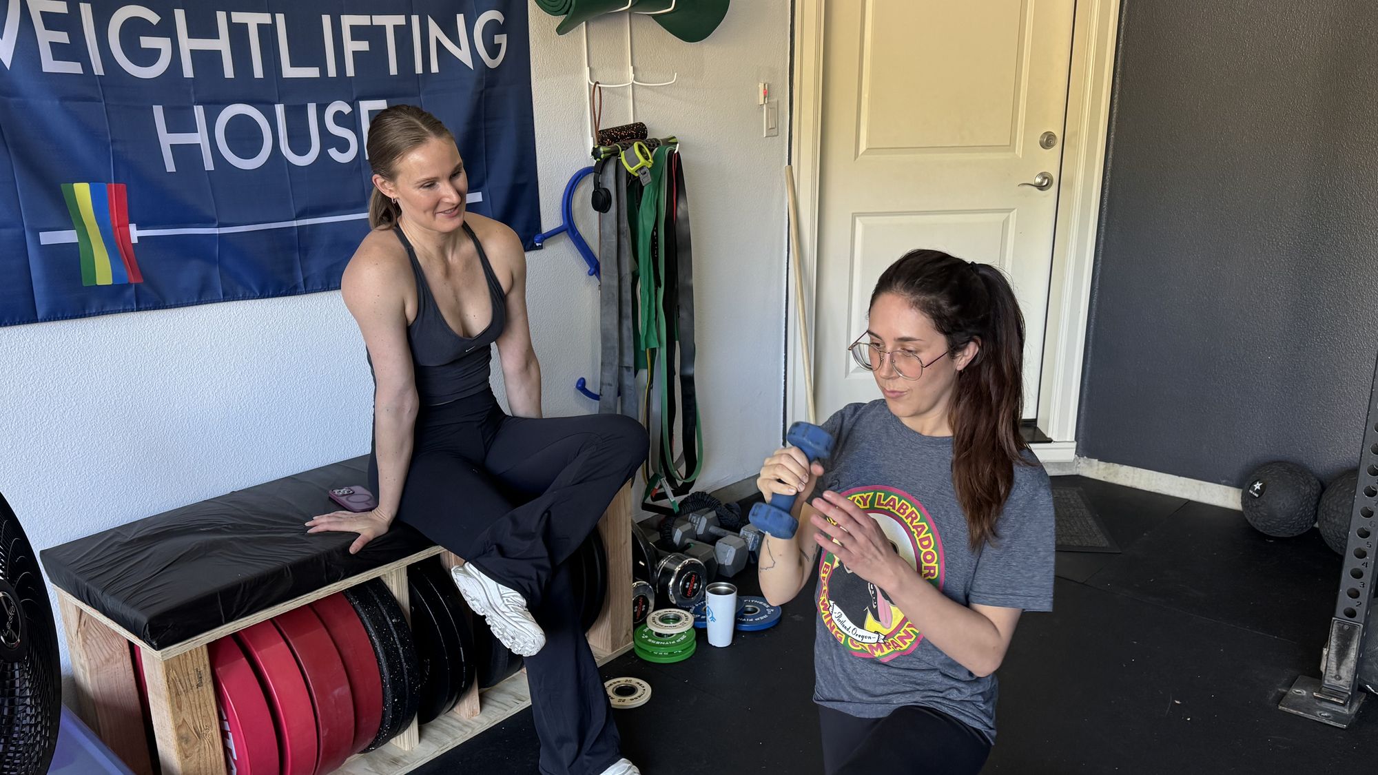 Coach Julia coaching a client through mobility work